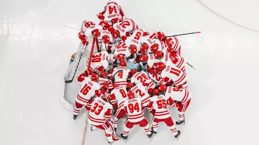 The Wisconsin. men's hockey team gathers before a game