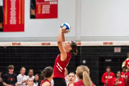 Addy Horner sets a ball in a match against Maryland.