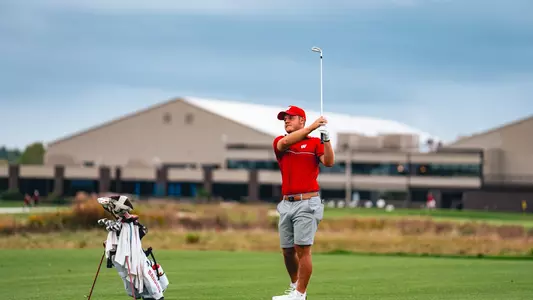 Jacob Beckman fires approach shot at Badger Invitational