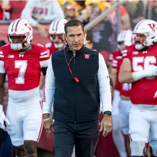 Luke Fickell leads the team out of the tunnel
