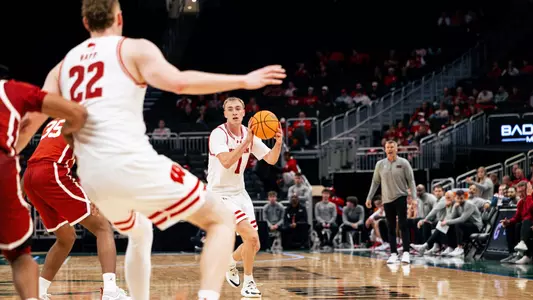 Andrew Rohde throws Austin Rapp an entry pass against Oklahoma