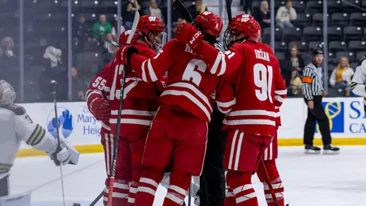 Wisconsin men's hockey celebrates scoring a goal at Lindenwood