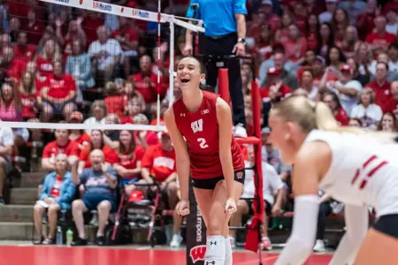 Setter Addy Horner celebrates after a rally against Michigan.