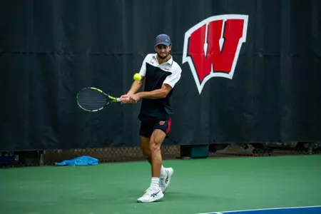 Michael Minasyan returns a serve
