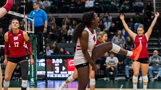 Aniya Warren celebrates after winning a point against Michigan State.