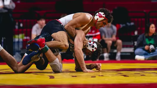 Julian George wrestles at the Cyclone Invitational