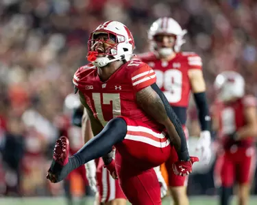 Darryle Peterson celebrates sack vs. Illinois