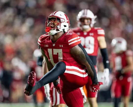 Darryle Peterson celebrates sack vs. Illinois