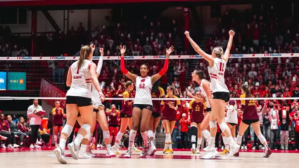 Carter Booth celebrates with teammates after winning a point against Minnesota.