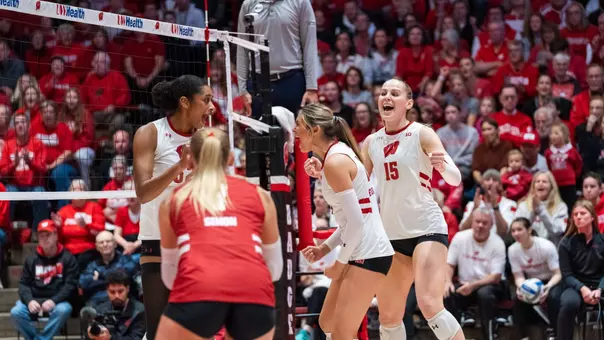 Badgers celebrate after winning a point against Indiana.