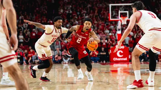 Nick Boyd drives through the lane against Nebraska