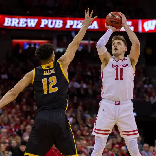 December 21, 2019: Wisconsin Badgers forward Micah Potter #11 shoots a jump shot over Milwaukee Panthers center Amir Allen #12 during the NCAA Basketball game between the Milwaukee Panthers and the Wisconsin Badgers at the Kohl Center in Madison, WI. Wisconsin defeated Milwaukee 83-64. John Fisher/CSM(Credit Image: © John Fisher/Cal Sport Media)
