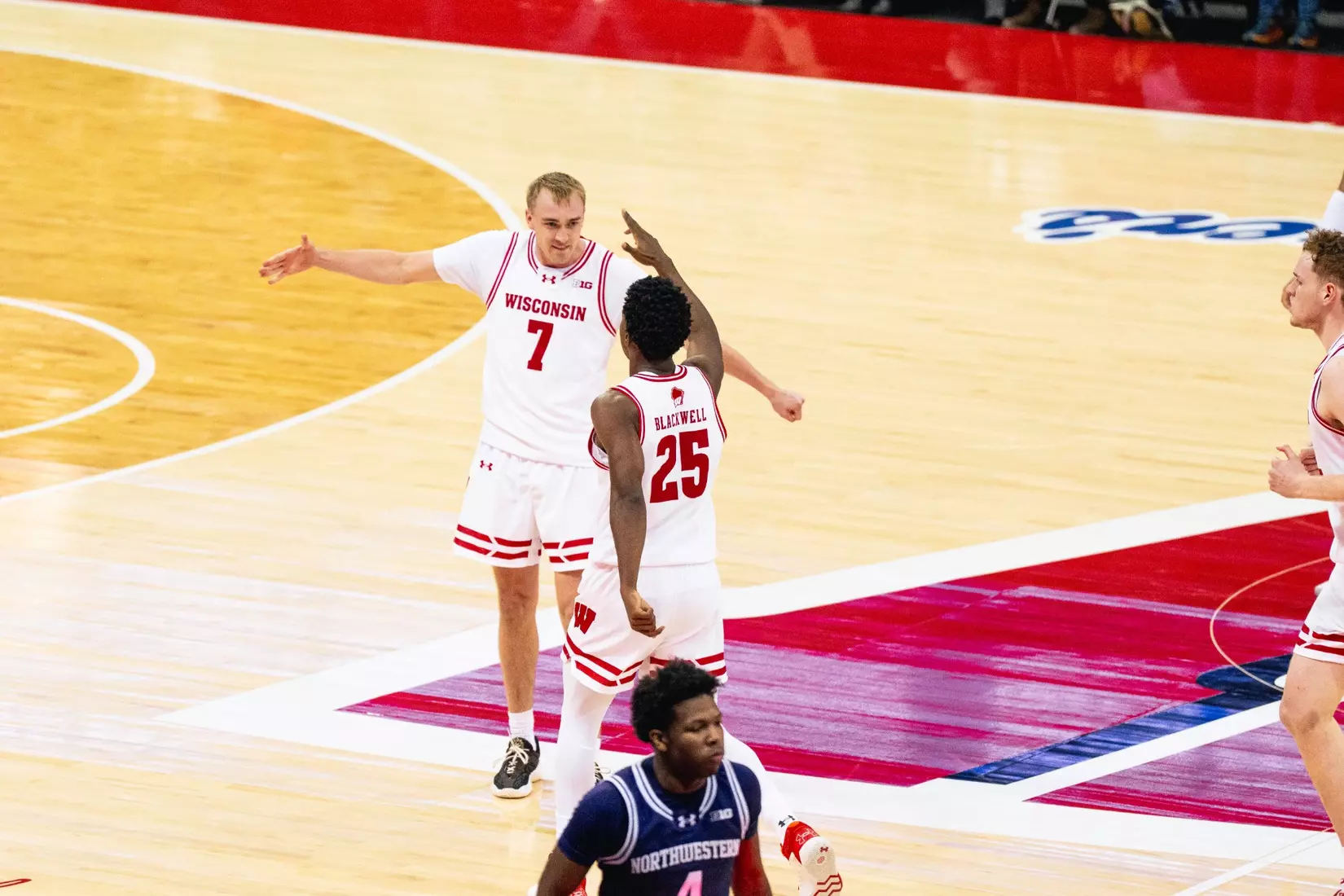 Andrew Rohde high-fives John Blackwell in win over Northwestern