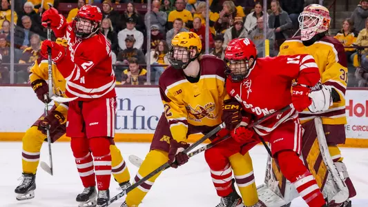 Ryan Botterill and Simon Tassy in front of the Minnesota net