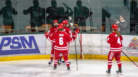 Simms, Eden and Badgers celebrate a goal on 2.22.25 against Bemidji State