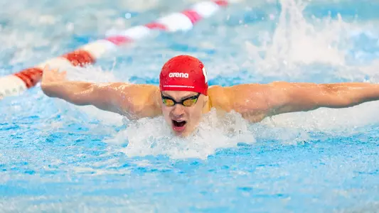 Charlie Jones swims butterfly in meet vs Northwestern