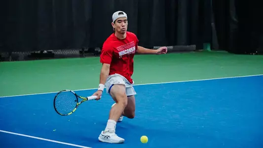 Matthew Fullerton returns a volley