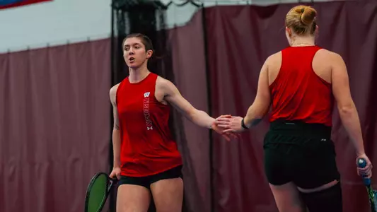 Cataldi and Reynoldson celebrate winning a ponit