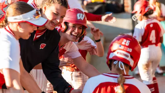 Softball celebrates a victory over Coastal Carolina
