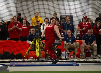 Chloe Lindeman makes a heave in the weight throw at Big Ten Indoors