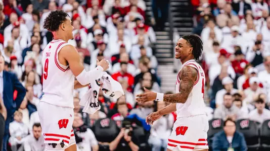 Kamari McGee celebrates with John Tonje against Indiana