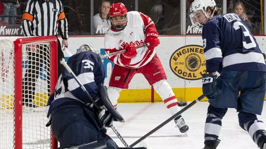 Simon Tassy shoots the puck against Penn State