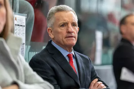 Mark Johnson coaches during an NCAA college women’s hockey game against the Minnesota Golden Gophers, Sunday, Feb. 9, 2025, in Madison, Wis. The Badgers won 6-1. (Photo by David Stluka/Wisconsin Athletic Communications)
