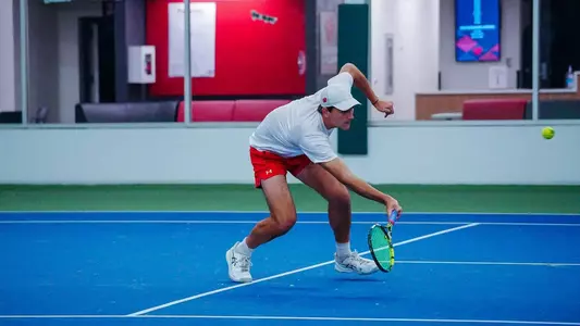 Collin Beduhn returns a drop shot