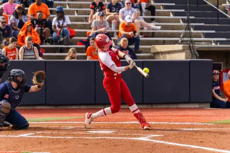 Emmy Wells barrels a softball in a game against Illinois