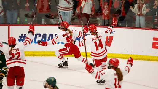 Kelly Gorbatenko and the Badgers celebrate a goal against Clarkson in the NCAA Regional Final on 3.15.25 at LaBahn Arena