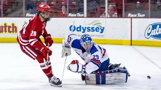 Adam Pietila puts the puck past the Team USA goaltender