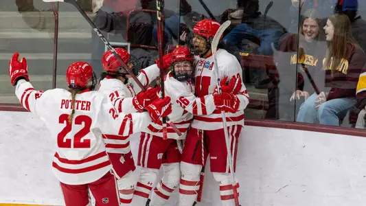 Laila Edwards and the Badgers celebrate a goal on 3.21.25 in the Frozen Four against Minnesota