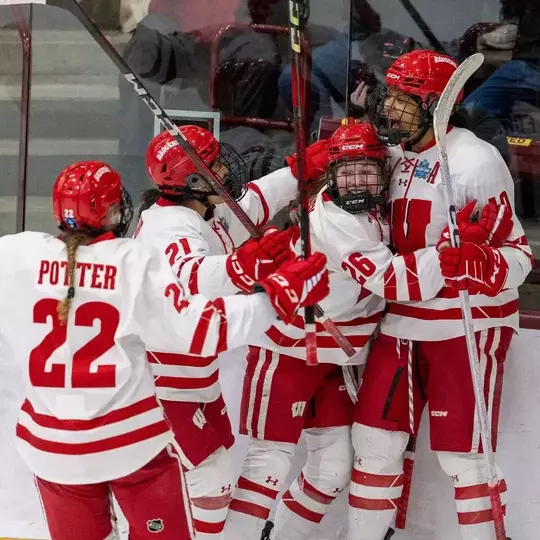 Laila Edwards and the Badgers celebrate a goal on 3.21.25 in the Frozen Four against Minnesota