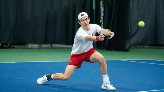 Matthew Fullerton returns a shot