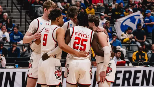Wisconsin huddles during Saturday's NCAA Tournament game against BYU