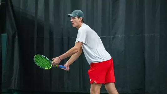 Collin Beduhn prepares to serve