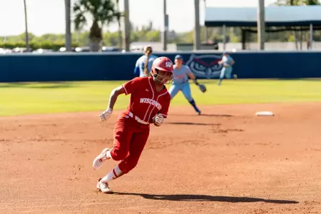 Emma King rounds third base in a game against Kansas