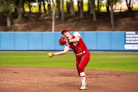 Hannah Conger gets ready to throw out a runner against Omaha