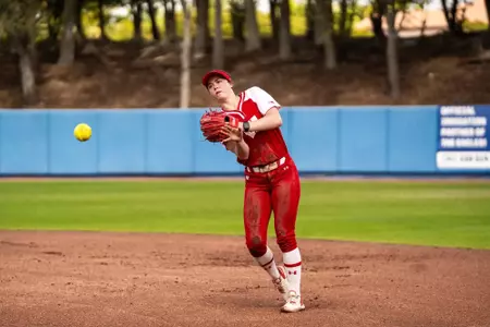Hannah Conger collects a ball in the field in a game against Omaha