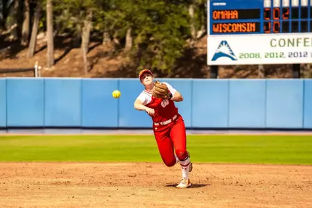 Ellie Hubbards throws to first in a game against Omaha