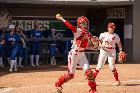 Emmy Wells throws out a runner at FGCU