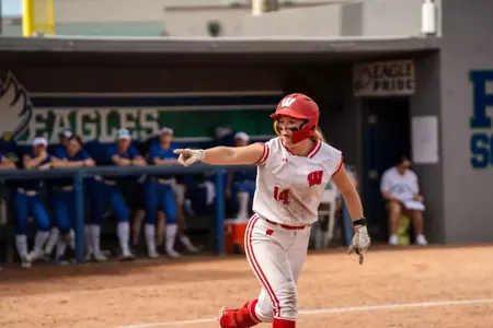 Kate Linkletter points to the dugout at FGCU