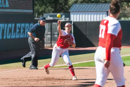 Hilary Blomberg throws out a runner against UConn