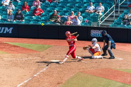 Emily Bojan turns on a pitch against Coastal Carolina