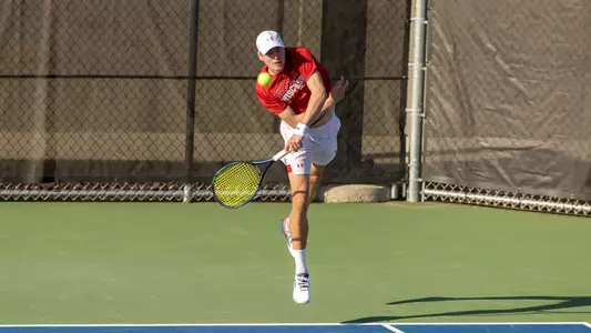 Oliver Olsson serves a ball