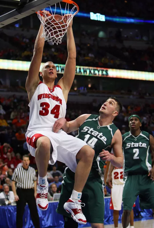Mar 9, 2007; Chicago, IL, USA; Wisconsin Badgers center (34) Greg Stiemsma dunks the ball over Michigan State Spartans center (34) Drew Naymick during the first half of the quarterfinals of the Big Ten Tournament at the United Center in Chicago, IL.  Mandatory Credit: Jerry Lai-USA TODAY Sports Copyright © 2007 Jerry Lai