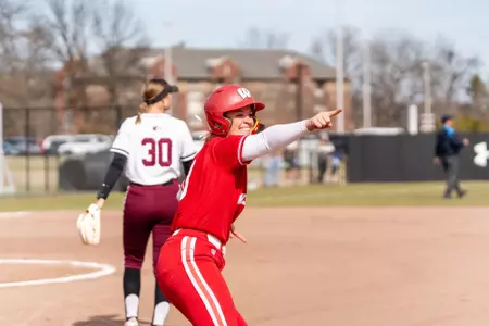 Emily Bojan points to the stands after a home run against SIU
