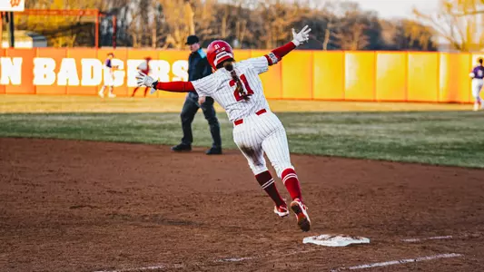 Ellie Hubbard circles the bases after hitting a go-ahead grand slam against St. Thomas