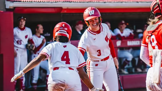 Emily Bojan high fives Emma King after scoring