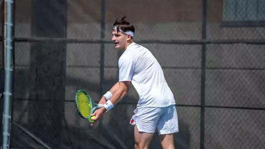 Patrik Meszaros prepares to serve